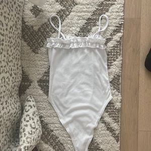 White ruffle body suit